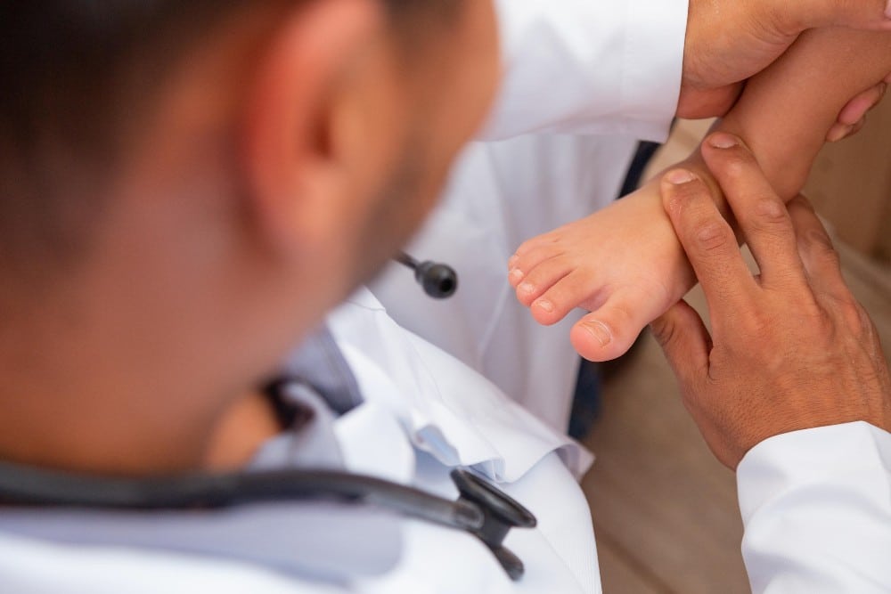 Doctor examining foot for HyProCure surgery